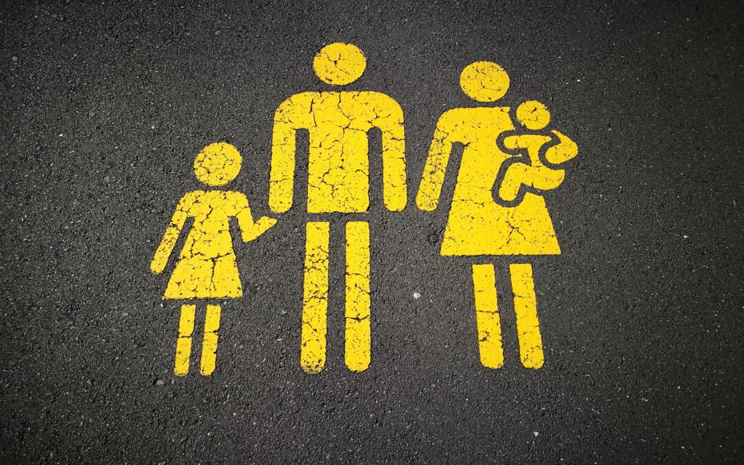 A Car Parking Space with a Family painted in yellow on it in the style of a mother and child bay.