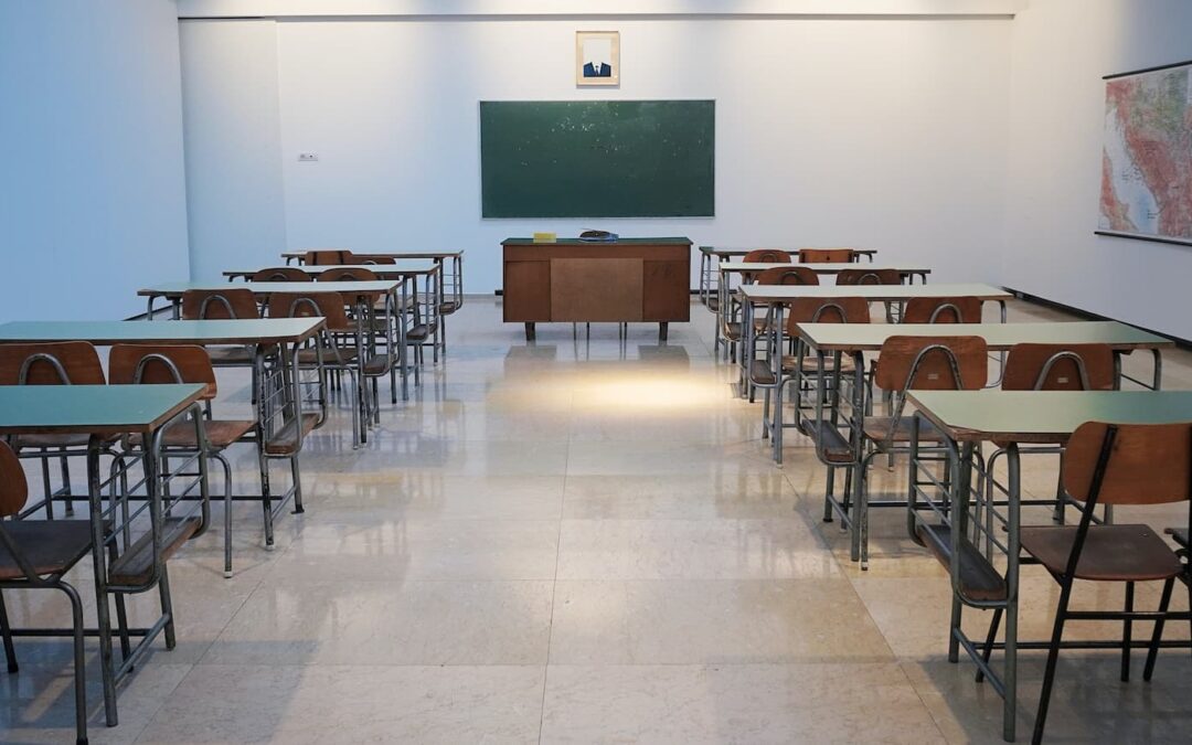 Rows of desks in an empty classroom.