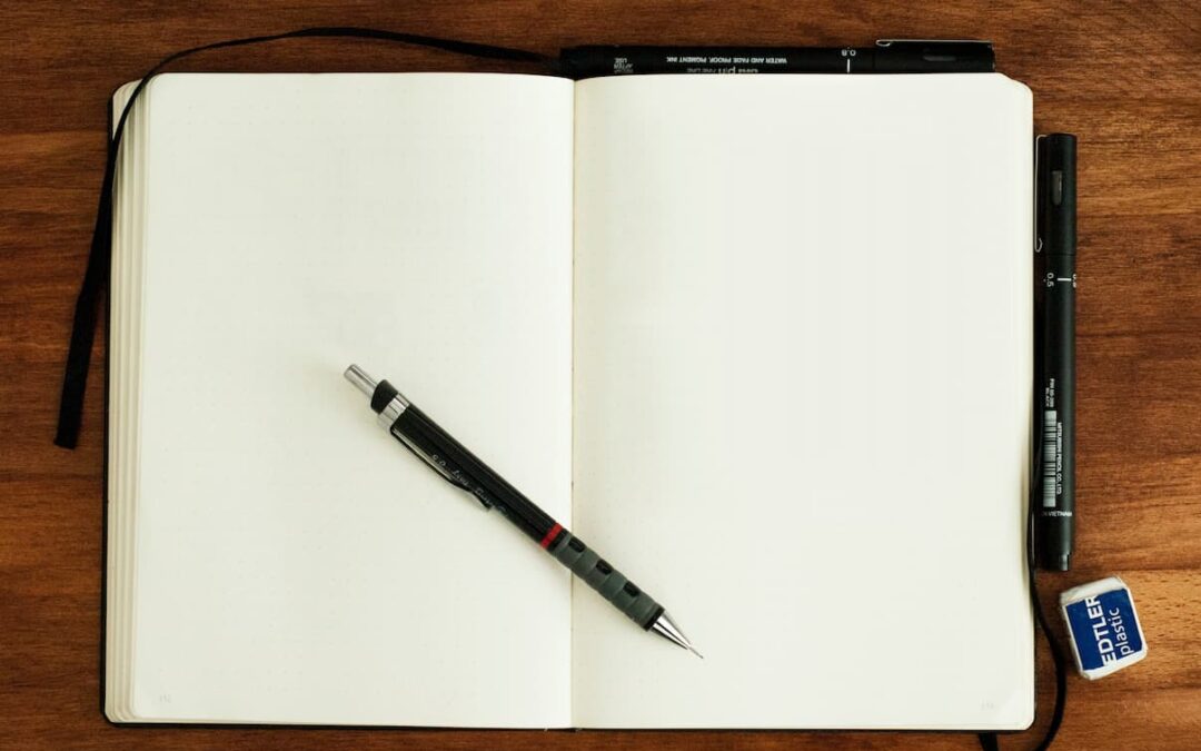 A blank notebook open on a desk.